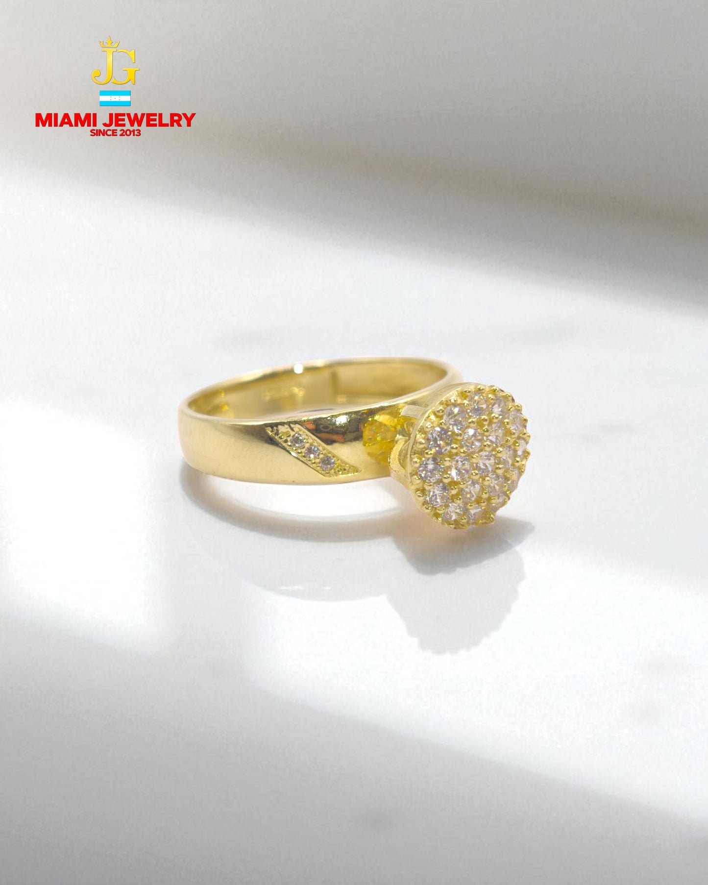 Solid 14k yellow gold wedding ring with white zirconia gemstones.