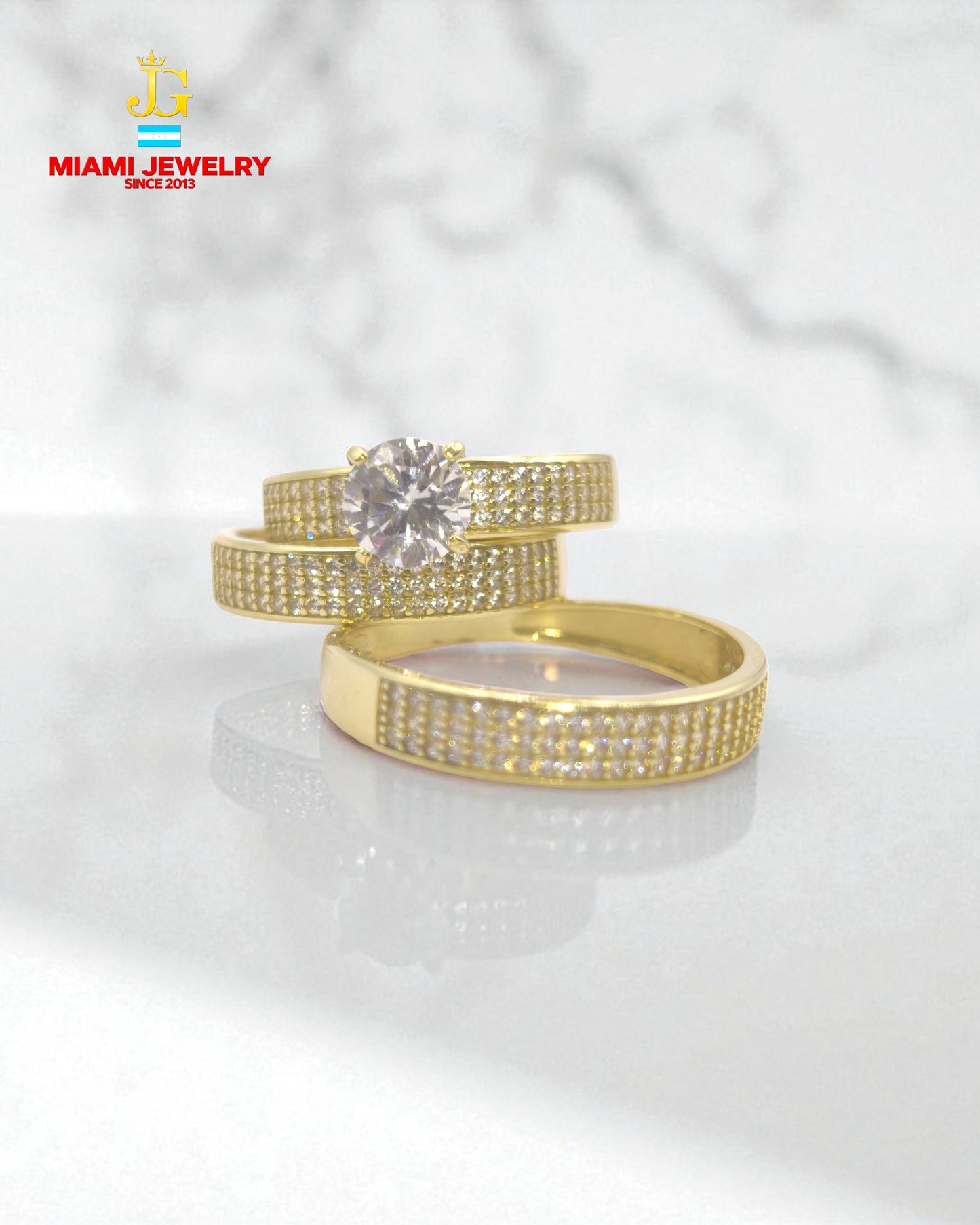 Solid 14k yellow gold wedding rings with white zirconia gemstones.