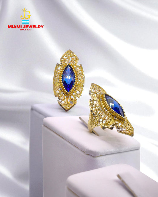 14k yellow gold oval-cut royal blue gemstone.