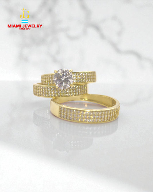 Solid 14k yellow gold wedding rings with white zirconia gemstones.