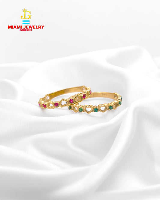 Solid 14k yellow gold with zirconia gemstones.