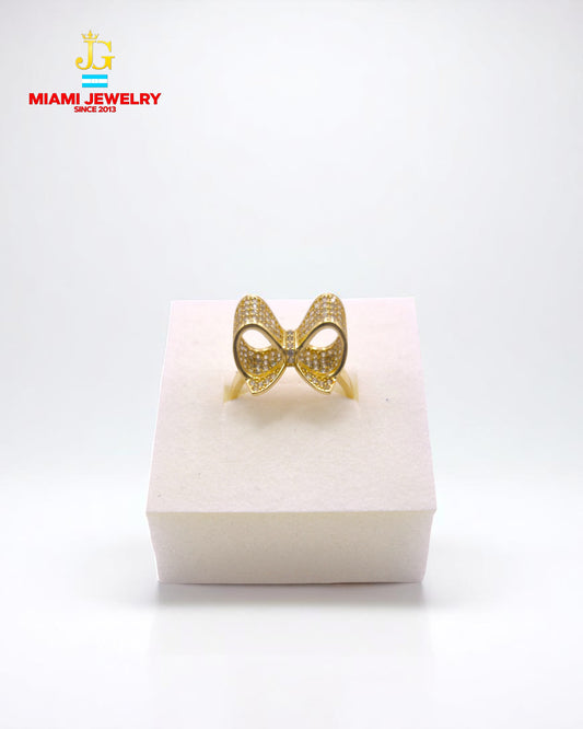 Solid 14k yellow gold bow with white-zirconia gemstones