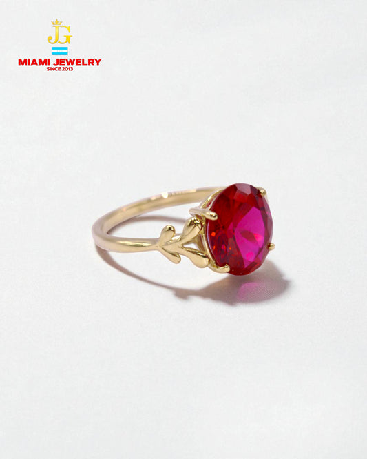 Solid 14k yellow gold oval-cut pink stone.